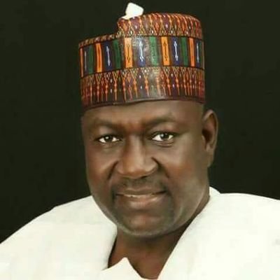 Aliyu Abubakar in white Agbada with a brown cap on his head