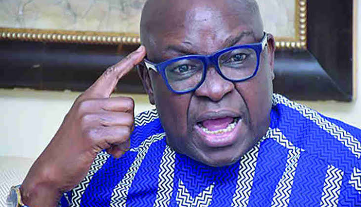 Ayodele Fayose in blue native attire and angry