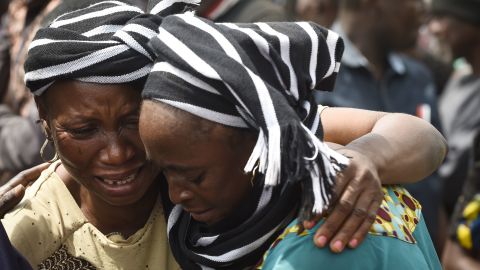 A woman crying and another consoling her