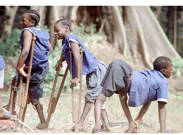 Polio victims wearing blue uniforms